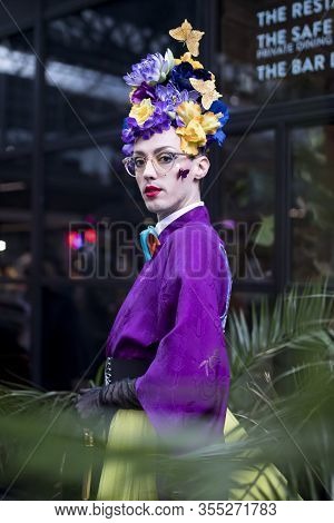 London, Uk- Febryary 15 2020: Fashionable People On The Street . Street Style. A Man In A Purple Kim