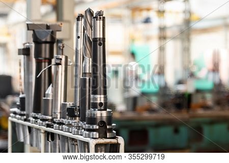 Conical And Collet Mandrels With Cutters And Drills On The Rack, Accessories For The Milling Machine