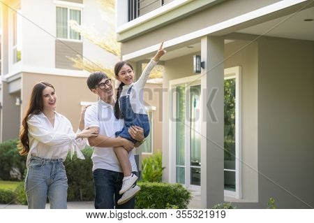 Beautiful Family Portrait Smiling Outside Their New House With Sunset, This Photo Canuse For Family,