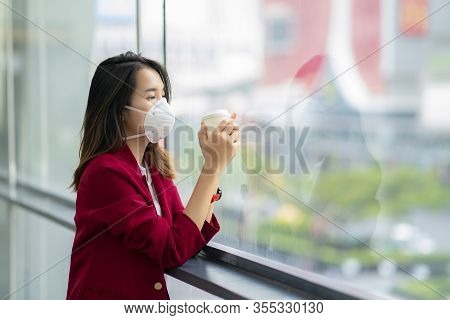 Asian Girl Use A Protection Mask For Prevent Pm 2.5 And Corona Viruus Or Covid 19 In Bangkok City.