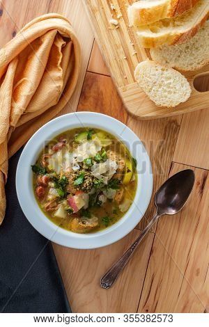 Italian Chicken Sausage Minestrone Soup Au Pistou Topped With Basil Pesto And Grated Parmesan Cheese