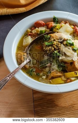 Italian Chicken Sausage Minestrone Soup Au Pistou Topped With Basil Pesto And Grated Parmesan Cheese
