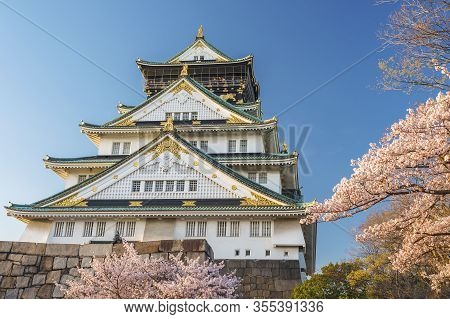 Osaka Castle With Sakura Flowerblossom In Japan