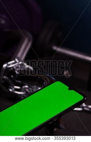 Weights And Chain In Gym. Fitness Equipment. Mobile App