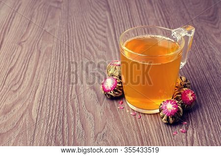 Green Tea Bud With A Red Flower