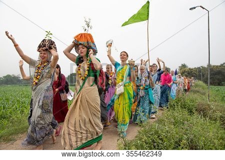 Mayapur, West Bengal, India - March 5, 2020. International Group Of Pilgrims In National Clothes Sar