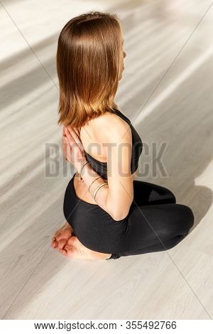 Overhead View Of Woman With Barefoot In Reverse Prayer Pose