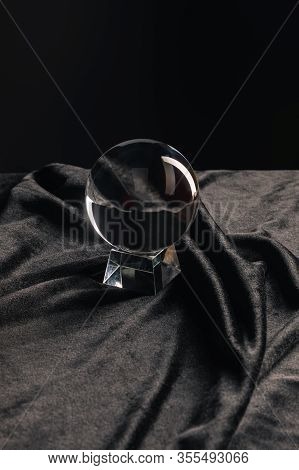 Crystal Ball On Fabric On Black Background