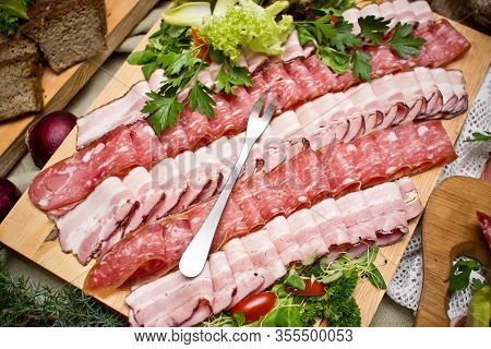 Party Meat Catering Table. Wedding Decorative Ham Slices. Various Meat Snacks Background. Salami Sli