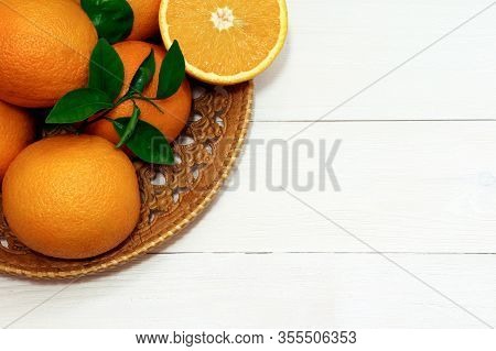 Orange Fruits On A Wooden Table. Healthy Food. Orange On A Tray.