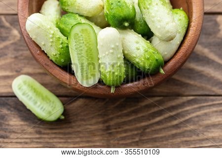 Small Snack Cocktail Dutch Cucumbers Quirk Variety On Wooden Background, Selective Focus