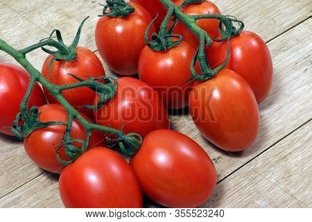Tomatoes Cherry On A Wooden Table. Healthy Food.