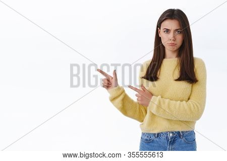 Jealous Pouting Offended Cute Sulky Girlfriend In Yellow Sweater, Frowning And Looking Insulted As P