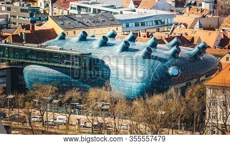 Graz, Austria - 10.03.2020: The Top Of The Kunsthaus Art Museum In Graz Austria Stands In Contrast T