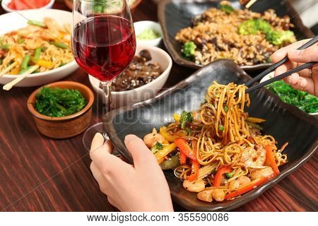 Woman Eating  A Tasty Chinese Noddles, A Closeup