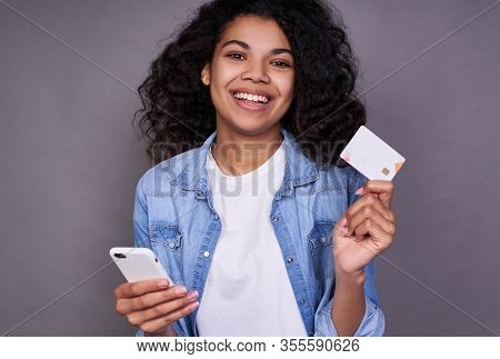 Close-up, Orthot Of A Happy Beautiful Young Afrian, American Woman In A White T-shirt And Denim Shir