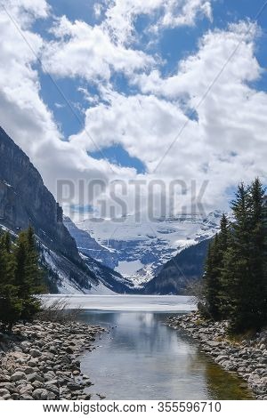 Mount Fairview, Partly Frozen Lake, With Reflection In Water. Lake Louise Banff National Park, Alber