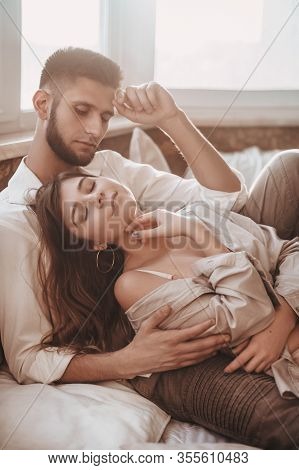 Stock Photo - Portrait Of Happy Loving Couple At Home