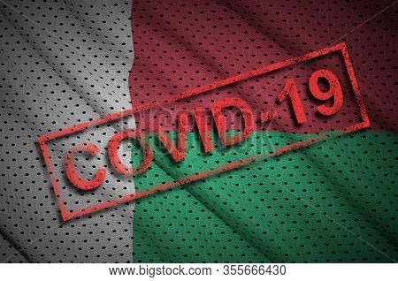 Madagascar Flag And Red Covid-19 Stamp. Coronavirus 2019-ncov Outbreak