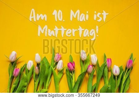 Colorful Tulip, Text Muttertag Means Mothers Day, Yellow Background