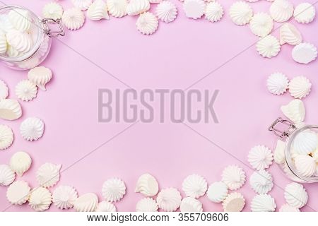 Small Meringue And Flass Jars With Small Meringues On Pink Background Flat Lay Top View Copy Space
