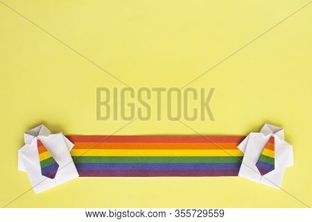 Long Stretch Lgbt Flags And Figures Of People. Shirt Made Of Paper With Color Tie, Origami. Rights O