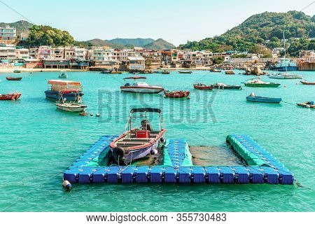 Hong Kong - January 25, 2016: The Small Bay Of Yung Shue Wan Village On Lamma Island Is Filled With 