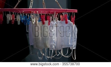 Alcohol, Gel And Sanitary Mask For Protection Against Virus Covic 19 Hanging In Front Of The House