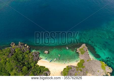Travel Concept: Tropical Sand Beach And Turquoise Water View From The Top. Lahos Island, Caramoan Is