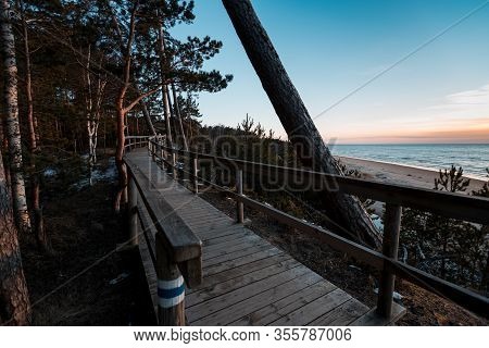 Wooden Walkpath During Sunset At Saulkrasti White Dune