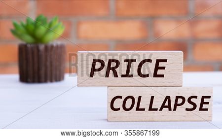 Bail The Word On Cubes Against The Background Of A Brick Wall With A Cactus.