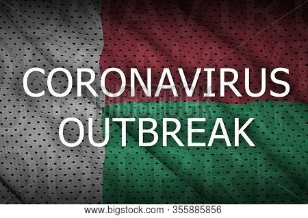 Madagascar Flag And Coronavirus Outbreak Inscription. Covid-19 Or 2019-ncov Virus