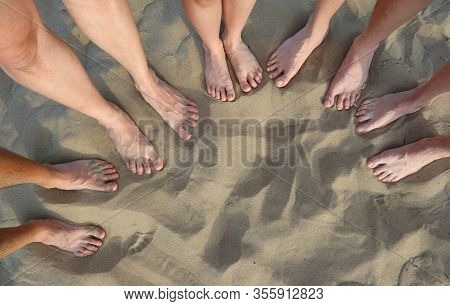 Ten Feet Of Family  On The Sandy Beach In Summer