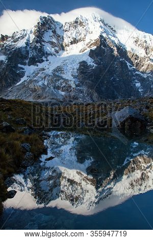 Evening View Of Mount Salkantay Mirroring In Lake, Salkantay Trek In The Way To Machu Picchu, Cuzco 