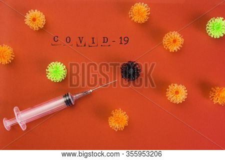 Syringe Vaccine Of Virus Convid 19 In Red Background