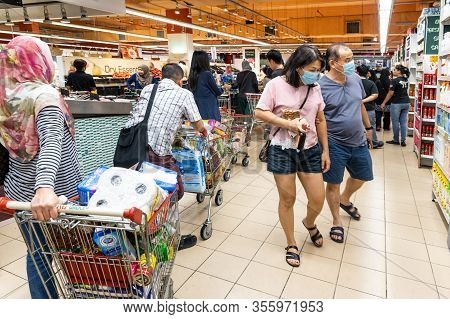 Kuala Lumpur, Malaysia, March 16, 2020: Panic Buying Among Shoppers At Supermarkets Resulting Empty