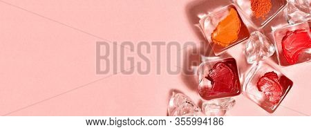 Creative Cosmetics Background. Top View Of Ice Cubes With Red Makeup Textures Samples. Design For Ma