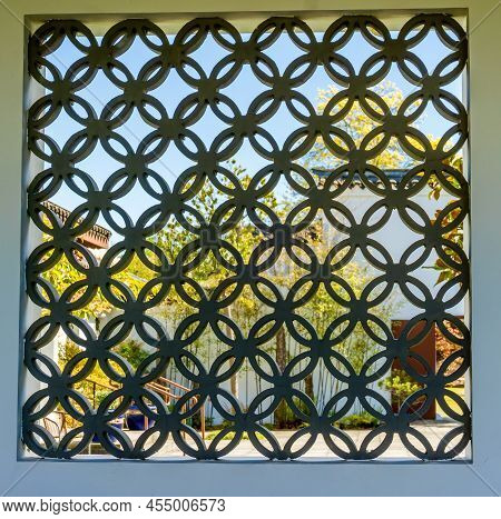 Latice Work On A Window In A Chinese Garden In South Seattle, Washington.