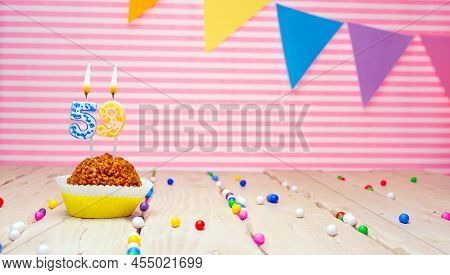 Happy Birthday For 59 Years Old. Festive Background With Muffin. Copy Space Birthday Card For Fifty 