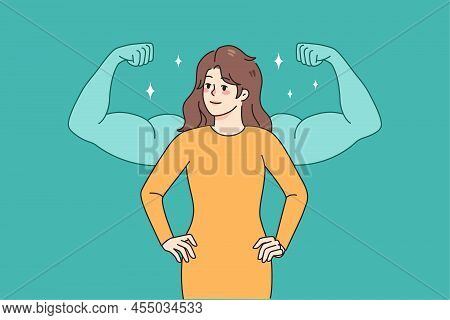 Confident Young Woman In Dress With Muscular Arms Behind Her Demonstrate Female Power. Happy Success