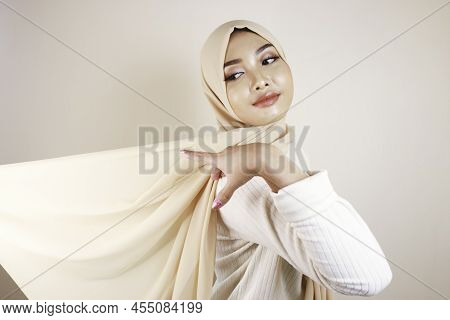 Muslim Woman Wearing Traditional Wear And Hijab Isolated On White Background. Hijab Is Creatively Ma