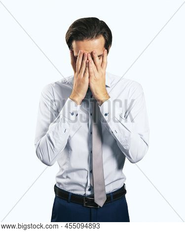 Stress And Find Solution Concept With Man In White Shirt Closing His Eyes, Facepalm Isolated On Whit