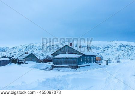 Snow-covered Church On The Barents Sea Coast Beyond The Arctic Circle In The Far North In The Murman