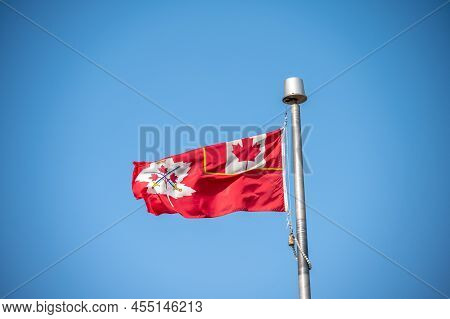 Canadian Army Flag On Blue Sky In Calgary