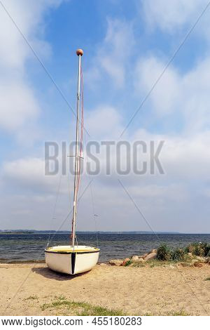 Lonely Sailboat On A Sandy Beach In Rewa, Poland