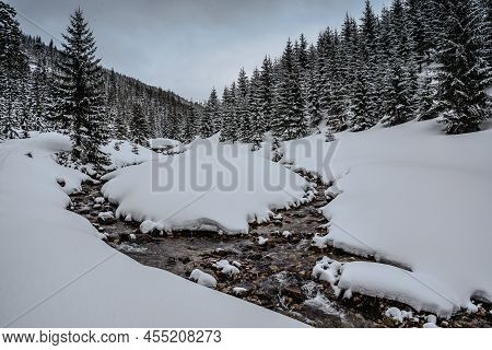 Winter River In Krkonose Mountains Near Spindleruv Mlyn,czech Republic.snowy Frozen Landscape.wild S