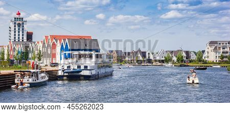 Harderwijk, Netherlands - May 22, 2022: Panorama Of A Cruiseship And Colorful Houses In Harderwijk, 