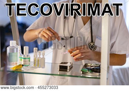 Tecovirimat. Nurse. Medical. Text Written On An Unfocused Background And Virus Design Of A Nurse Wit