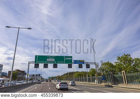 Beautiful View Of Highway On Blue Sky With White Clouds Background. Cityscape. Europe. Sweden. Stock