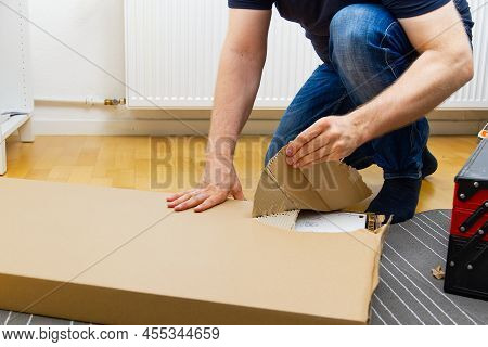 Professional Furniture Assembly Worker Assembles Shelf. Furniture Assembly Process. Diy Assembling